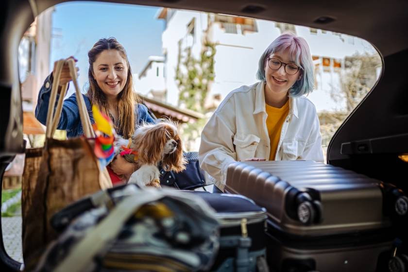 two women packing a car