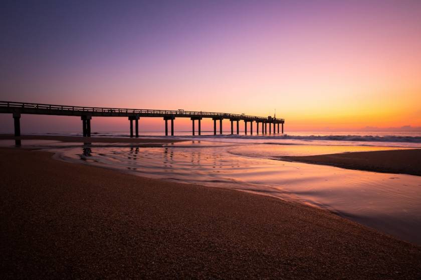 Sunset on St. Augustine Beach with view of the pier