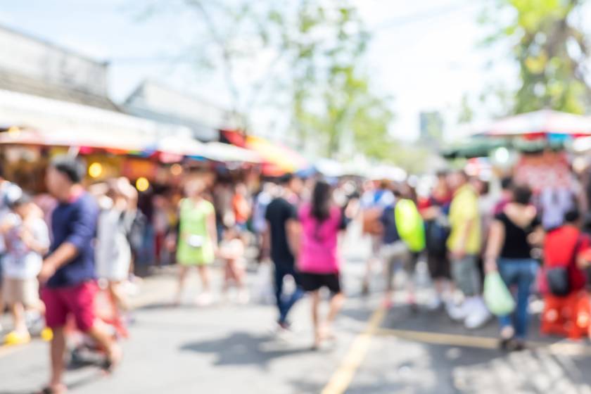 blurry image of a street festival 